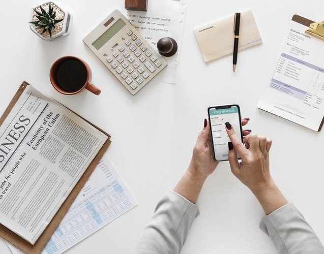 top desk with newspaper - 7 Big Mistakes to Avoid as a Beginner Trader